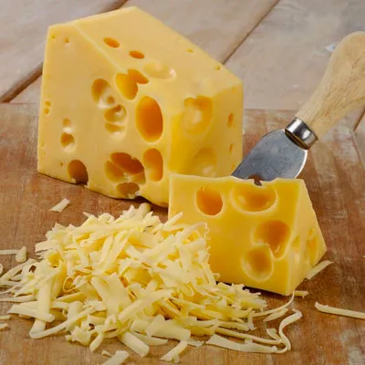 a piece of organic cheddar cheese